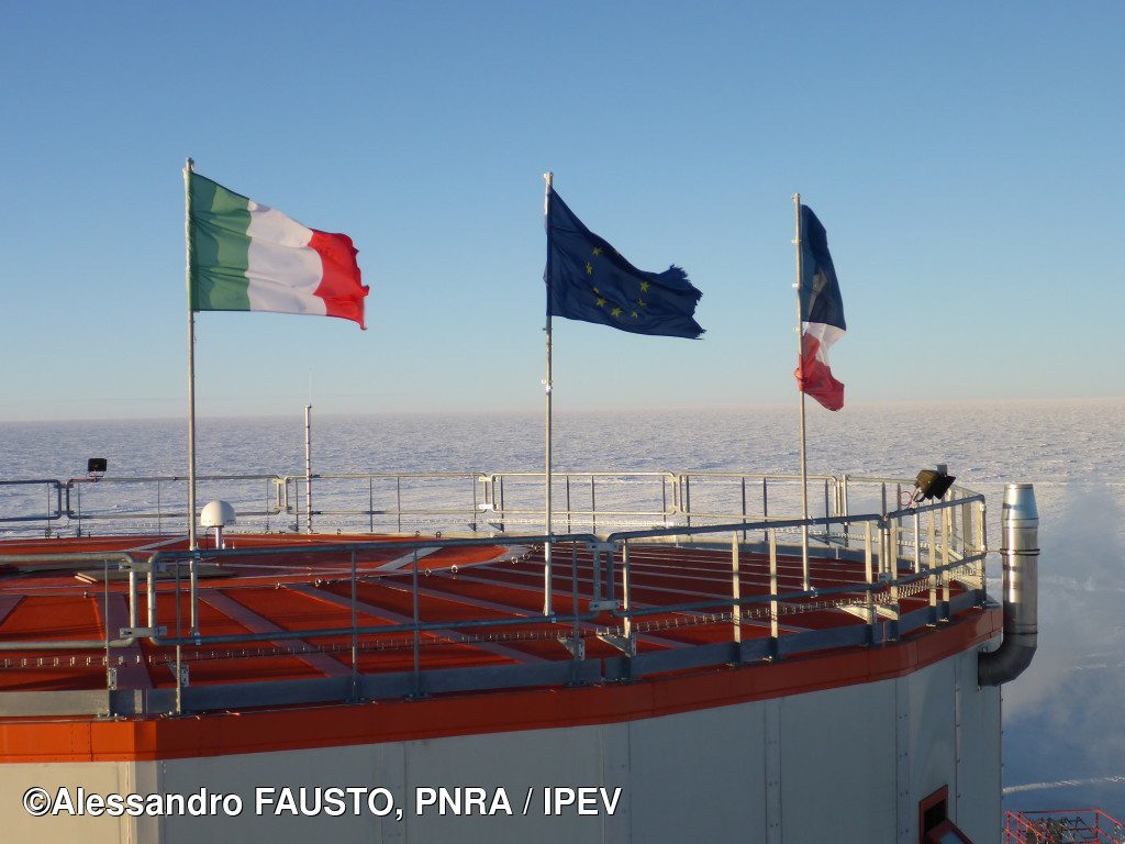 Italian, french and EU flags on the Concordia Base Tower